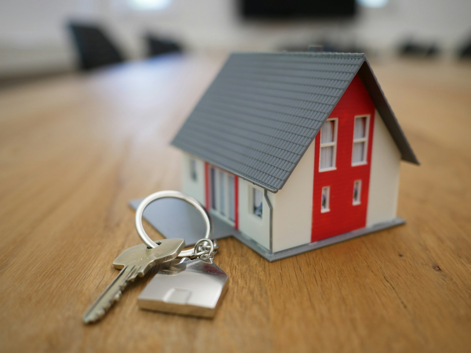 Real estate signing — keys and contract on a table